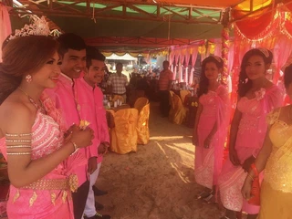 Cambodian wedding reception. I think the bride and groom are on the left.