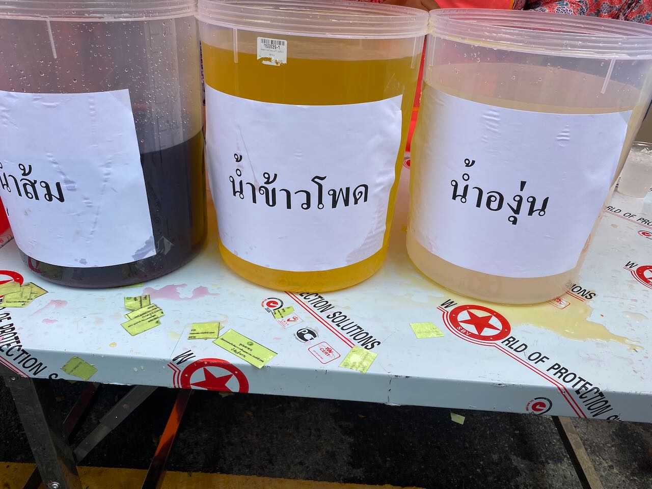 Children's festival drinks. From left to right, orange, corn, and grape. Never would have guessed.