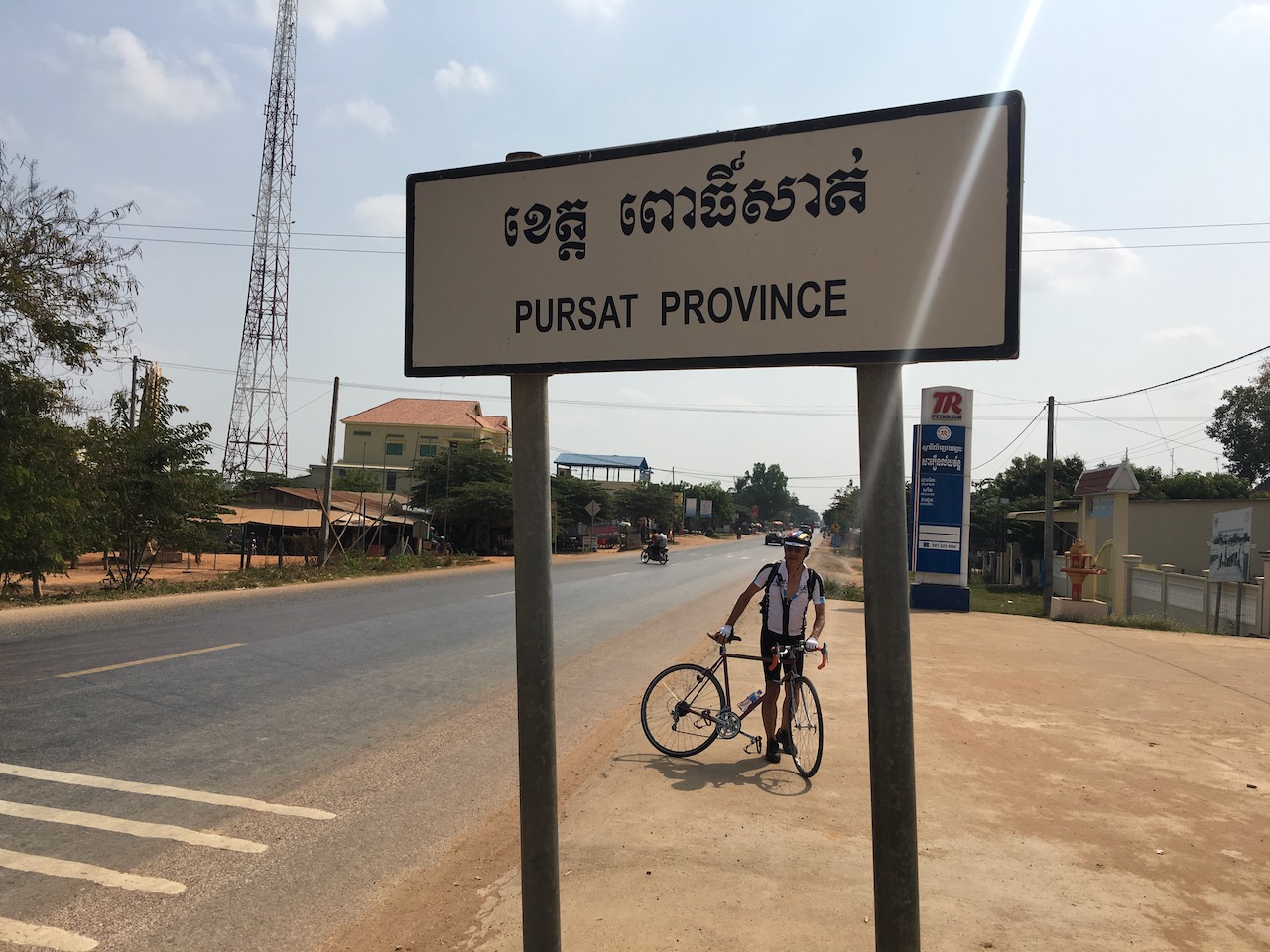 Crossing into Pursat Province. ពោធិ៍សាត់ [poːsat] Pursat means \"floating banyan.\" According to Wikipedia, the root word ពោធិ៍- Poŭthĭ [poː], a Khmer word derived from the Sanskrit and Pali word for the bodhi (बोधि) tree (which is where the Buddha became enlightened), and -សាត់ săt [sat] which comes from the Khmer word រសាត់ rôsăt [rɔːsat] meaning \"to float.\"